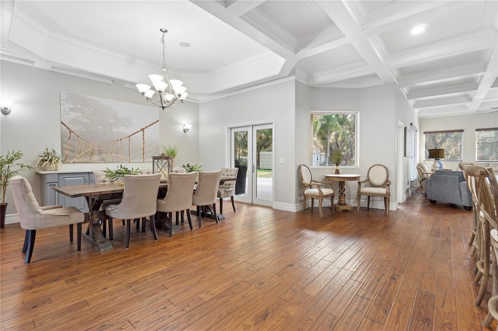3108 Carter Jones Road Groveland, FL 34736 - Photo 10 of 54 a view of a dining room with furniture and wooden floor