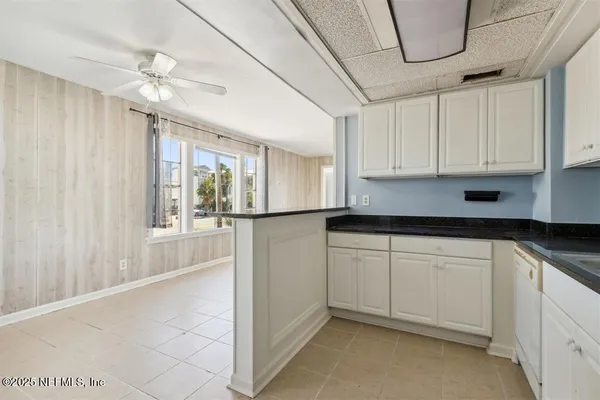 a view of a kitchen with electric appliances