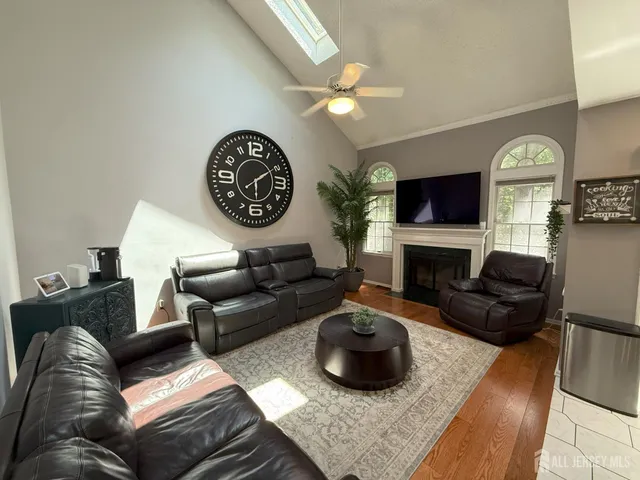 a living room with furniture and a fireplace