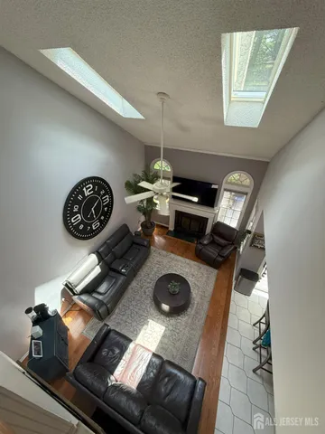 a table with a stove and a wooden floor