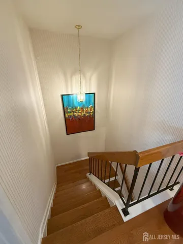 a view of a balcony with wooden floor