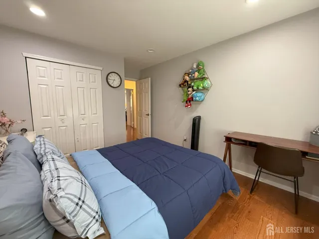 a bedroom with a bed and a table