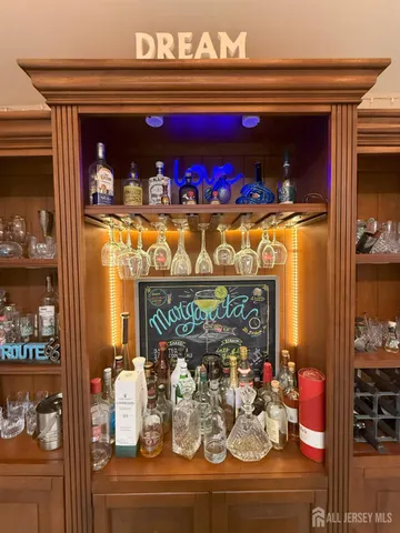 a dining room with furniture and a kitchen