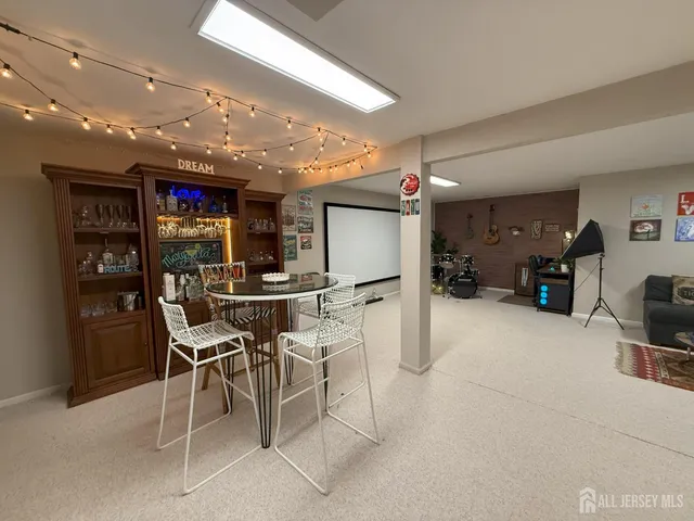 a living room with furniture and a rug