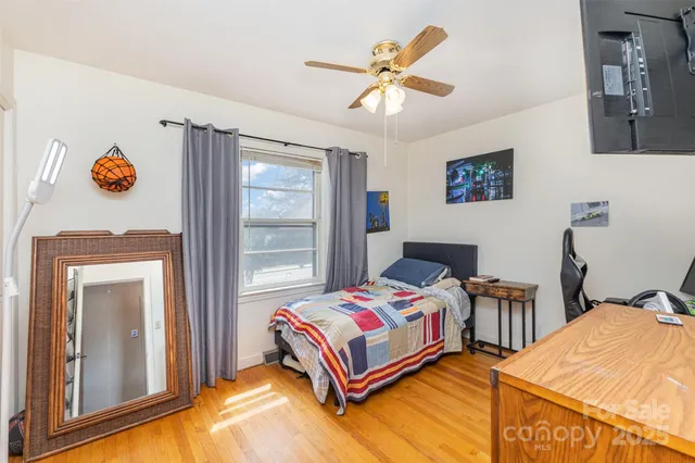 a bedroom with a bed and a table in it