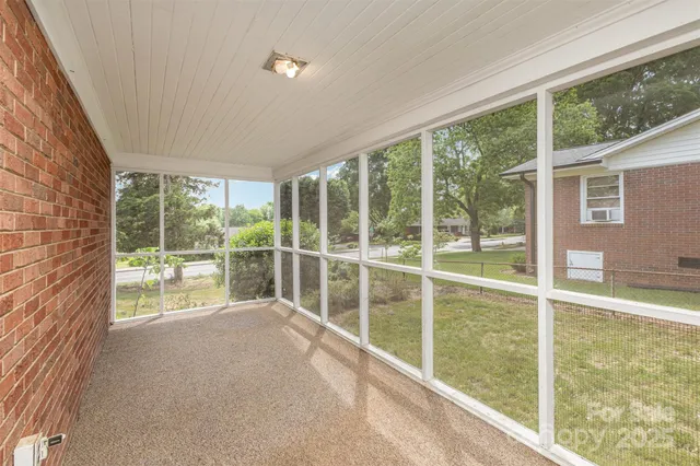 a view of a yard with a tree