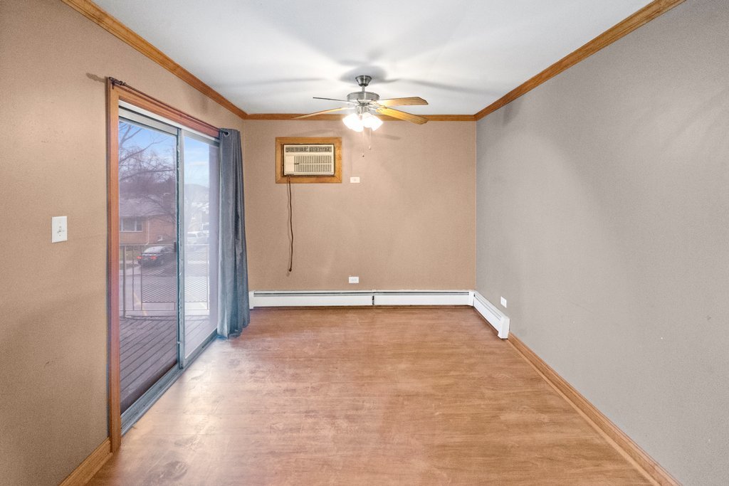 14501 Keystone Avenue, Unit 12 Midlothian, IL 60445 - Photo 4 of 11 a view of an empty room with a window
