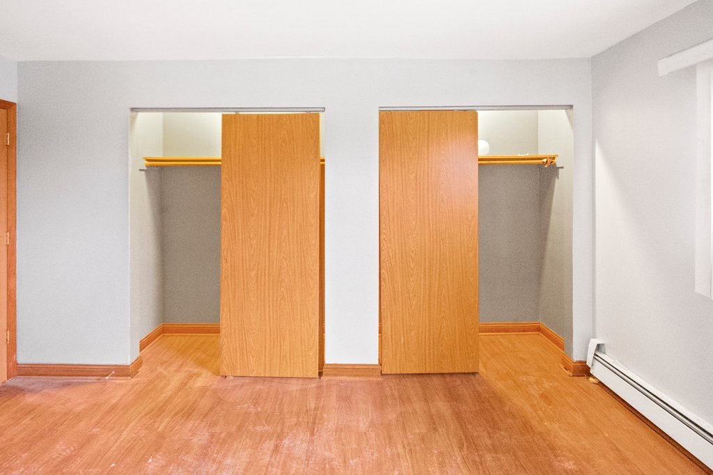 14501 Keystone Avenue, Unit 12 Midlothian, IL 60445 - Photo 6 of 11 a view of empty room with wooden floor and fan