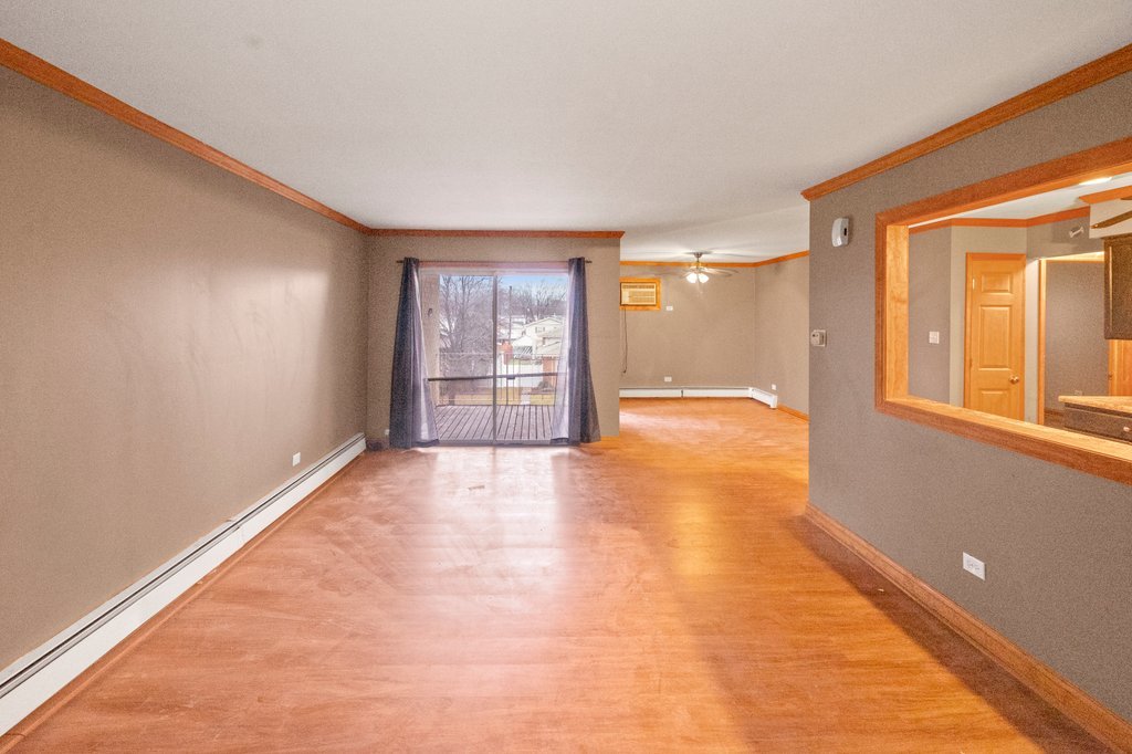 14501 Keystone Avenue, Unit 12 Midlothian, IL 60445 - Photo 10 of 11 a view of a livingroom with a staircase