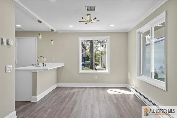 a bathroom with a sink and a window