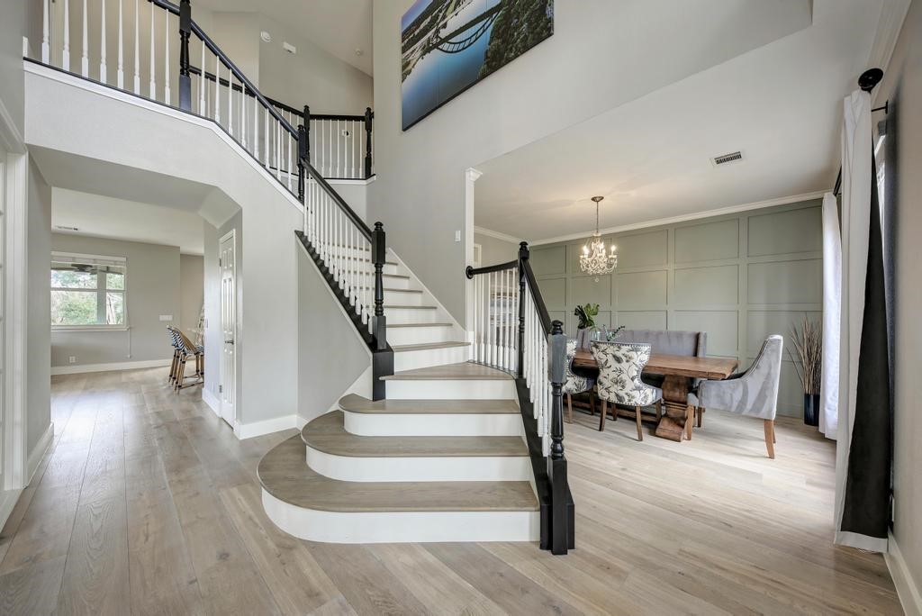 a view of entryway and hall with wooden floor