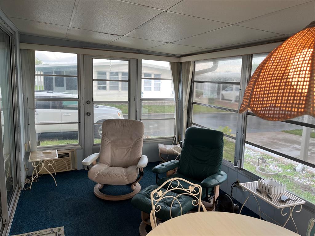 806 Jolanda Circle Venice, FL 34285 - Photo 16 of 44 a living room with furniture and a large window