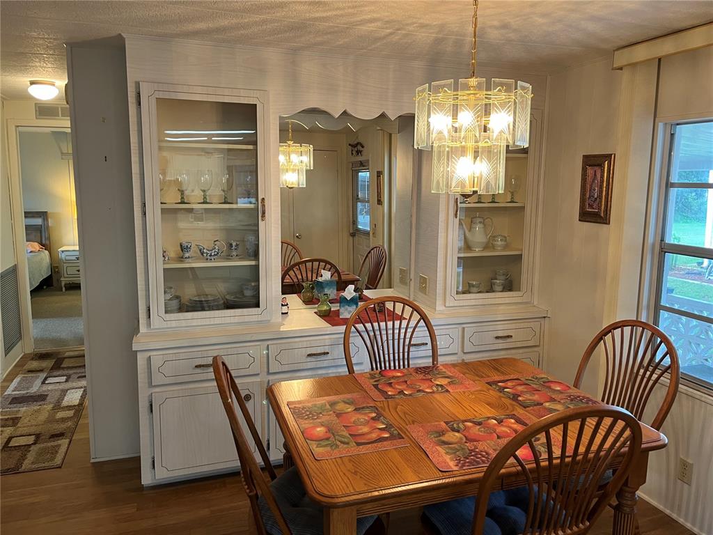 806 Jolanda Circle Venice, FL 34285 - Photo 20 of 44 a view of a dining room with furniture and chandelier