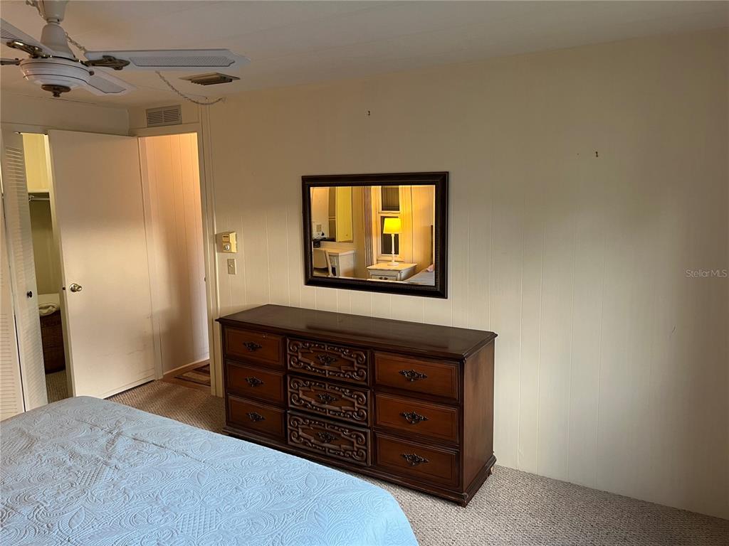 806 Jolanda Circle Venice, FL 34285 - Photo 36 of 44 a bedroom with a bed and a dresser