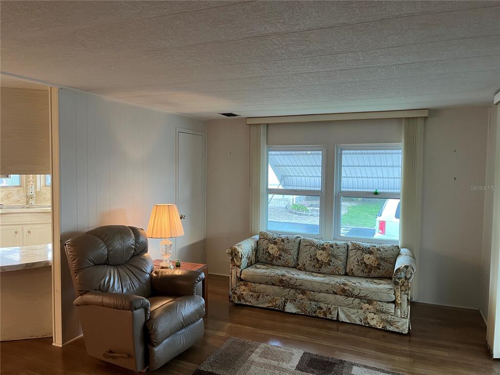 806 Jolanda Circle Venice, FL 34285 - Photo 9 of 44 a living room with furniture and a window