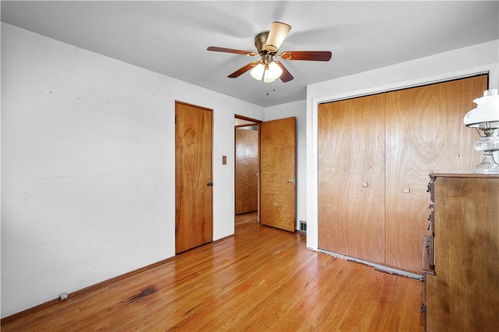 257 Robinhood Road Pittsburgh, PA 15220 - Photo 19 of 35 a view of an empty room with wooden floor