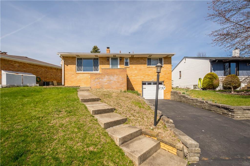 257 Robinhood Road Pittsburgh, PA 15220 - Photo 2 of 35 a front view of a house with garden