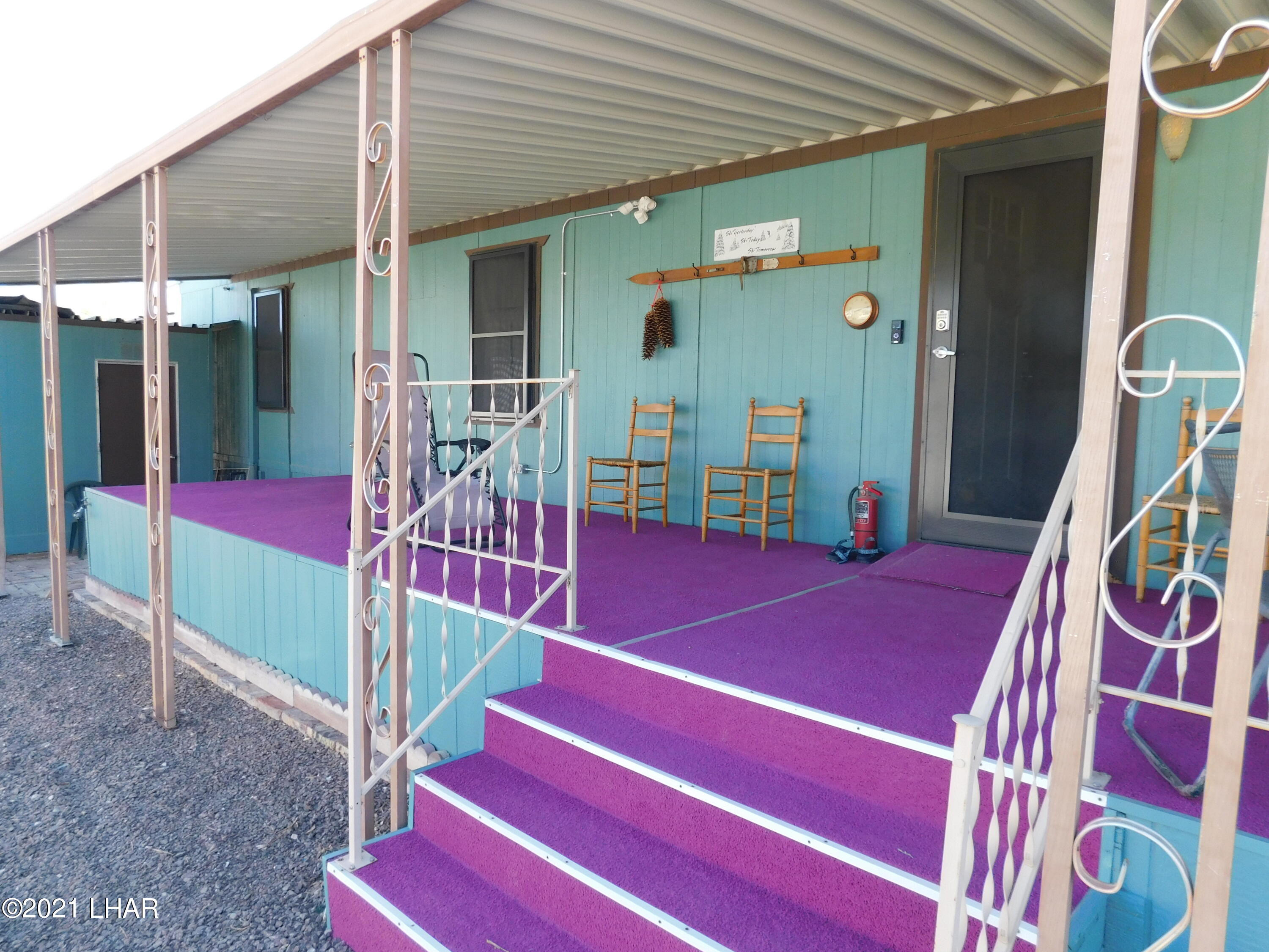 1240 Acacia Road, Unit 139 Quartzsite, AZ 85346 - Photo 31 of 37 Deck patio is covered. Security screen protect all windows.