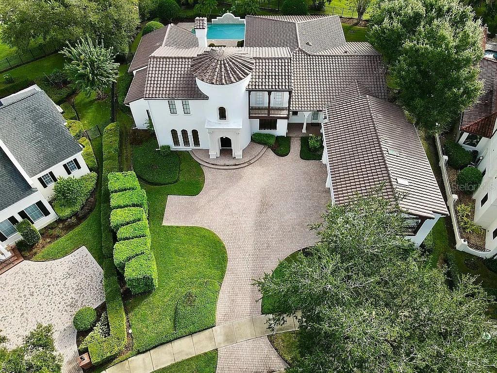 234 Acadia Terrace Celebration, FL 34747 - Photo 1 of 38 an aerial view of a house with a yard and potted plants