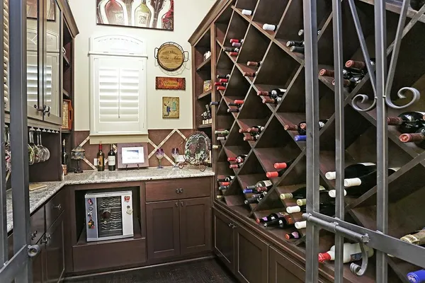 a kitchen with stainless steel appliances kitchen island granite countertop a refrigerator and stove