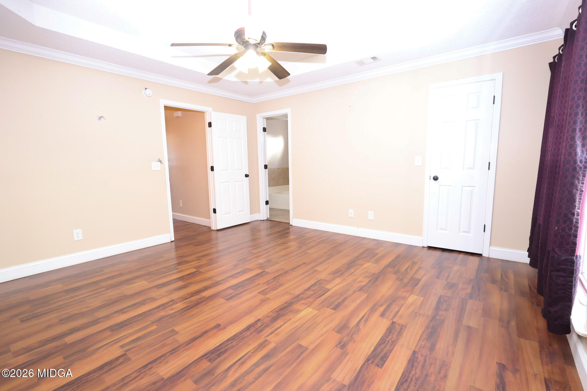 1025 Feagin Mill Road Warner Robins, GA 31088 - Photo 11 of 28 a view of a room with wooden floor and ceiling fan