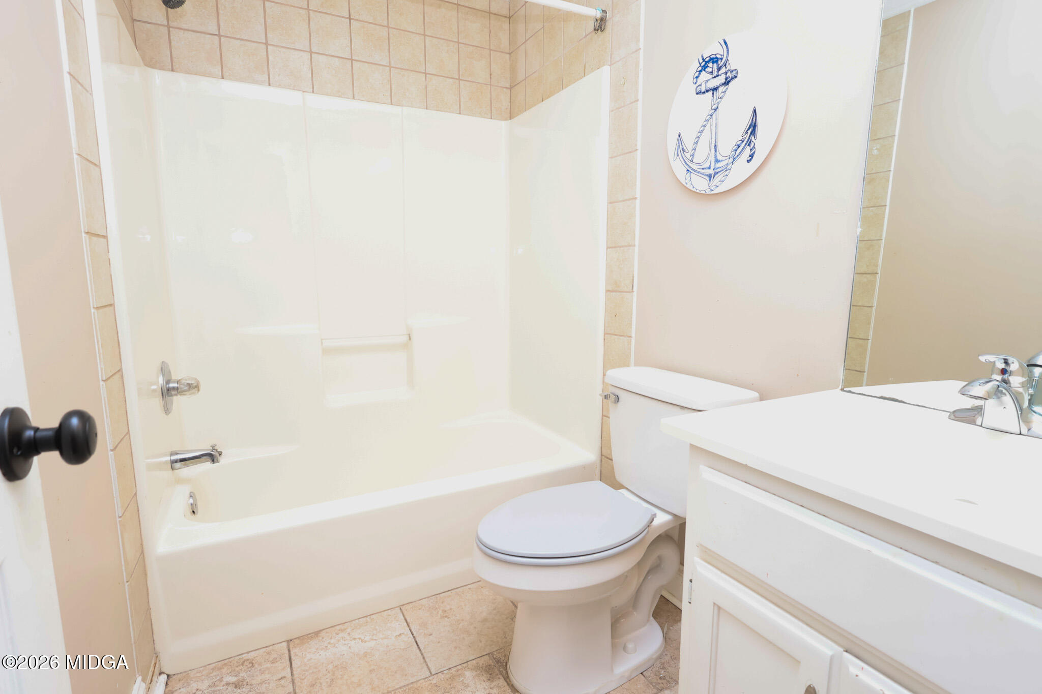 1025 Feagin Mill Road Warner Robins, GA 31088 - Photo 17 of 28 a bathroom with a sink a toilet and a bathtub