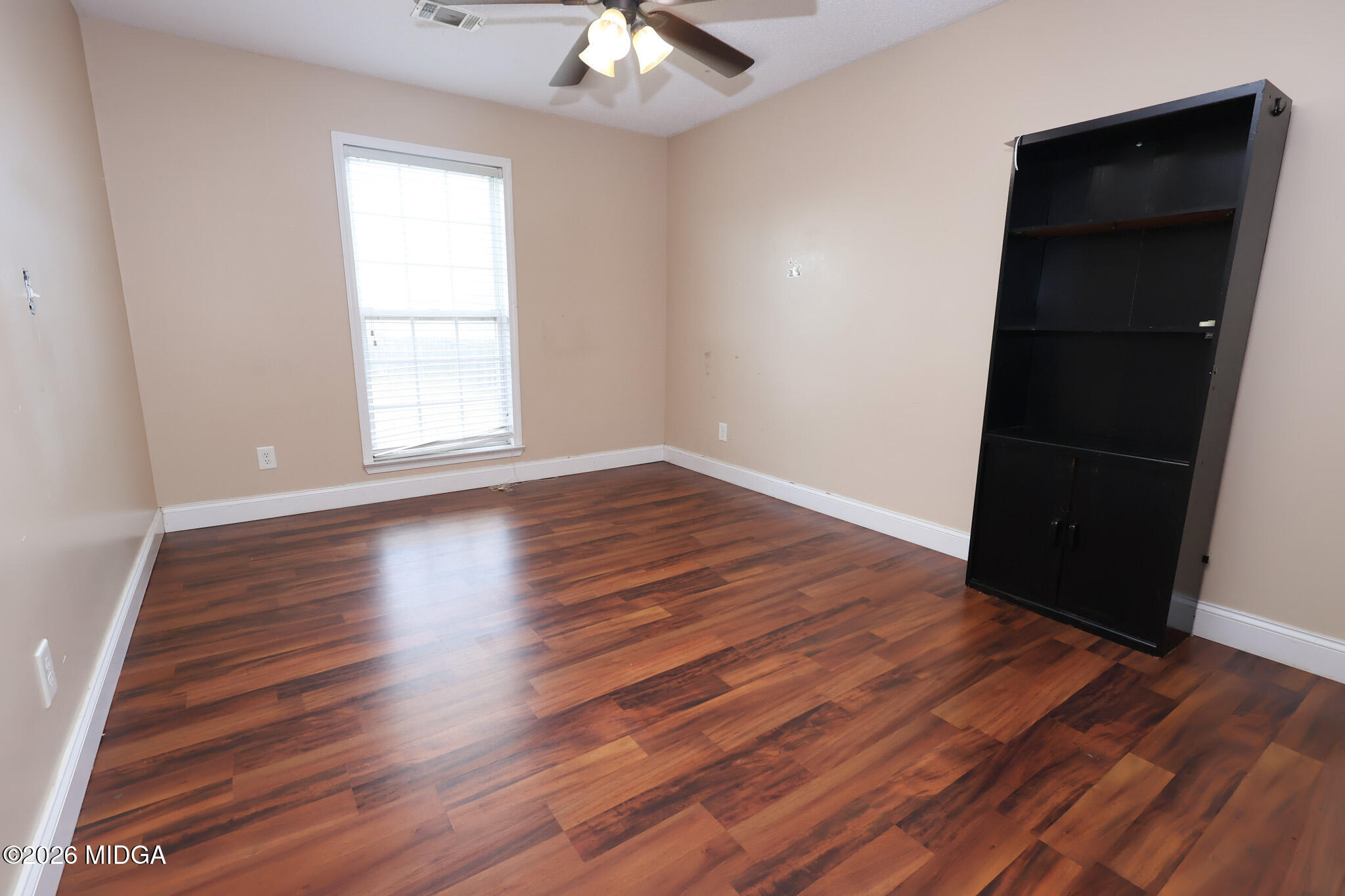 1025 Feagin Mill Road Warner Robins, GA 31088 - Photo 19 of 28 an empty room with wooden floor and closet