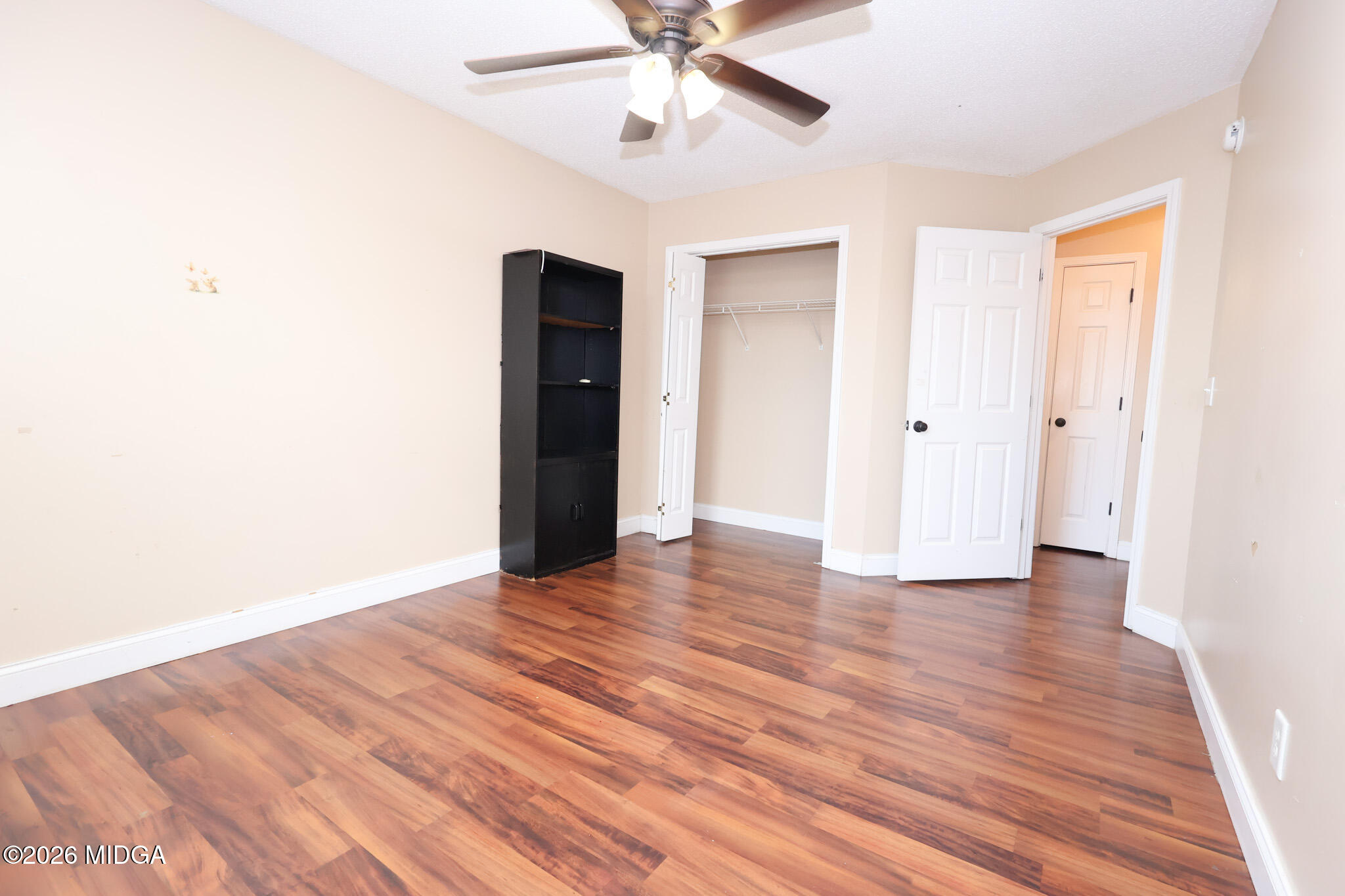1025 Feagin Mill Road Warner Robins, GA 31088 - Photo 20 of 28 a view of an empty room with wooden floor