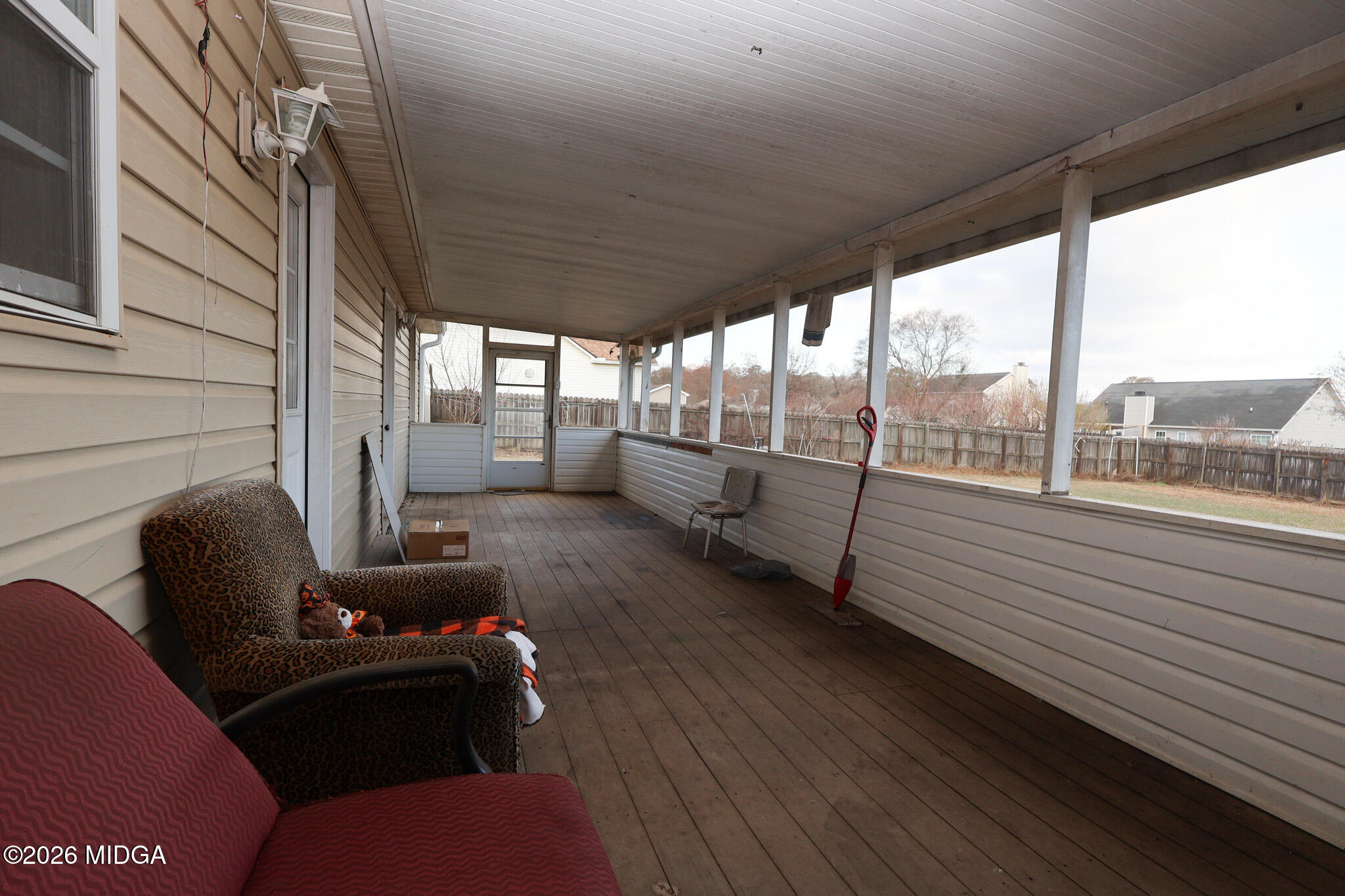 1025 Feagin Mill Road Warner Robins, GA 31088 - Photo 22 of 28 a living room with furniture and a floor to ceiling window