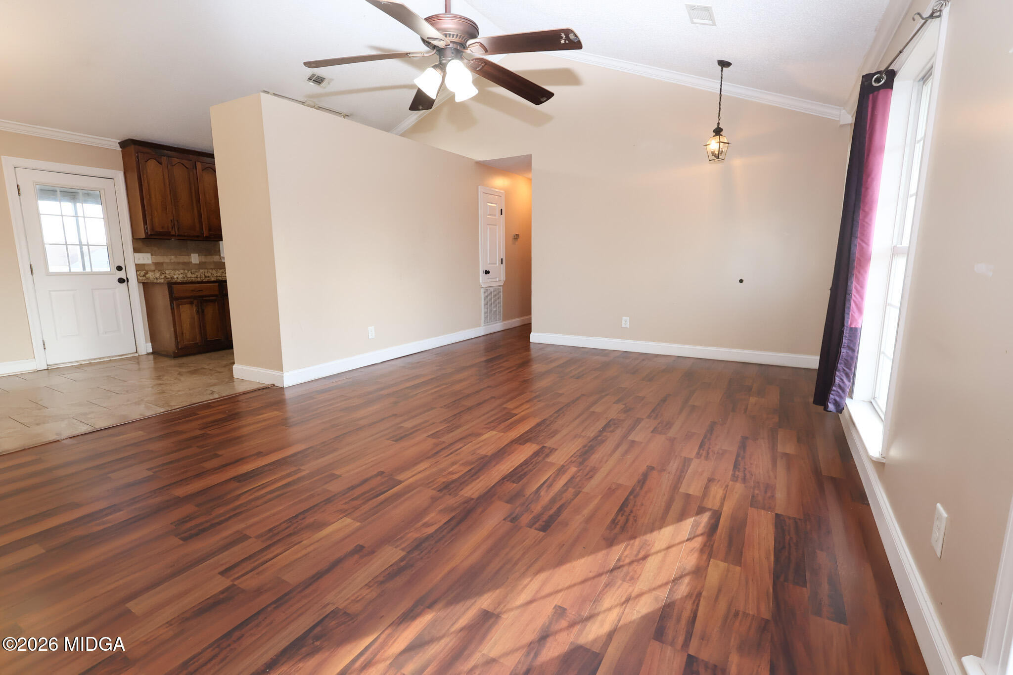1025 Feagin Mill Road Warner Robins, GA 31088 - Photo 3 of 28 wooden floor in an empty room with a window