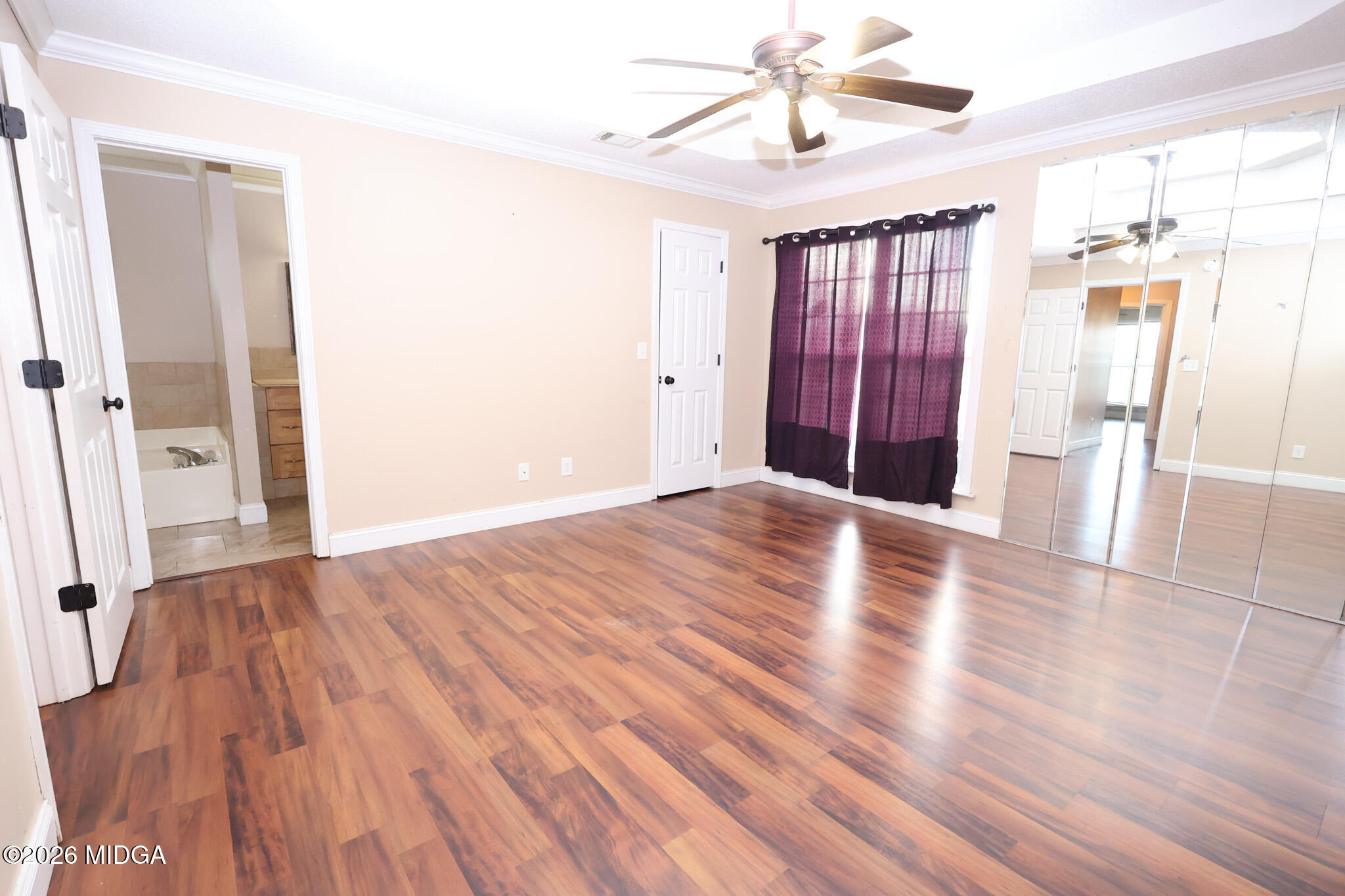 1025 Feagin Mill Road Warner Robins, GA 31088 - Photo 10 of 28 wooden floor in an empty room with a window