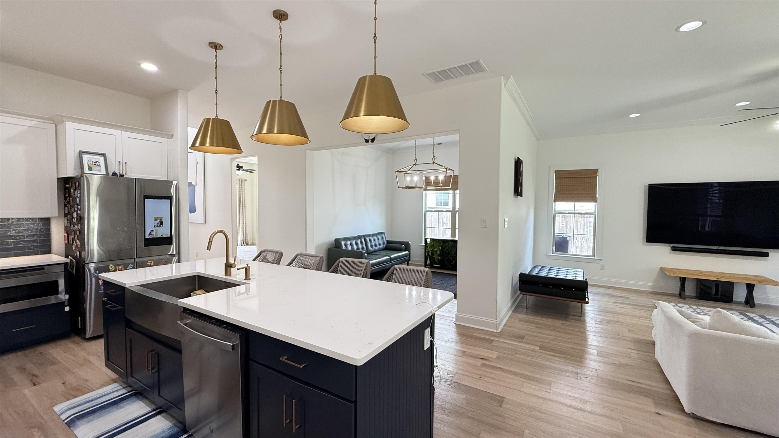 1746 Chadwick Farms Loop North Collierville, TN 38017 - Photo 35 of 35 Kitchen with open floor plan, stainless steel appliances, light countertops, light wood-style flooring, and recessed lighting