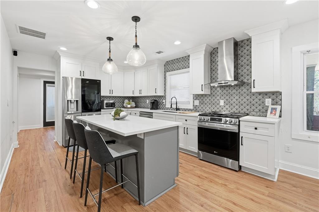 1973 Glendale Drive Decatur, GA 30032 - Photo 11 of 28 a kitchen with a sink a stove a refrigerator and a oven