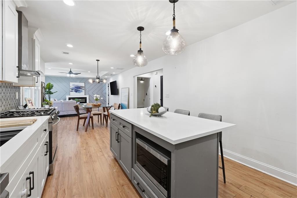1973 Glendale Drive Decatur, GA 30032 - Photo 13 of 28 a large kitchen with a table and chairs