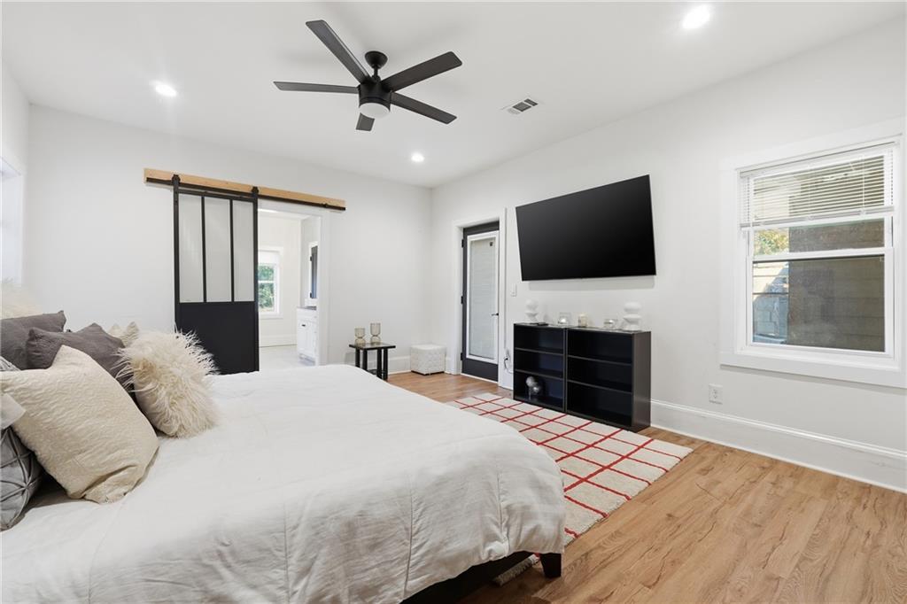 1973 Glendale Drive Decatur, GA 30032 - Photo 16 of 28 a bedroom with a bed and a flat screen tv