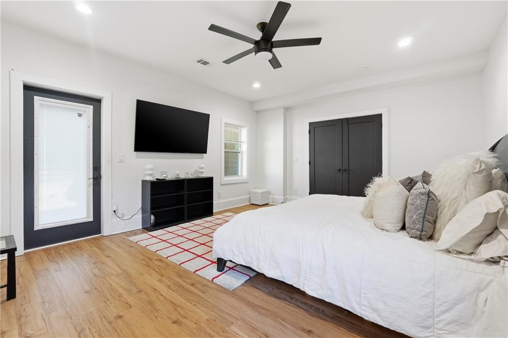 1973 Glendale Drive Decatur, GA 30032 - Photo 17 of 28 a bedroom with a bed and a flat screen tv