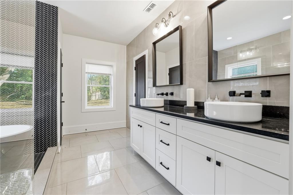 1973 Glendale Drive Decatur, GA 30032 - Photo 18 of 28 a spacious bathroom with sinks mirror and view bedroom