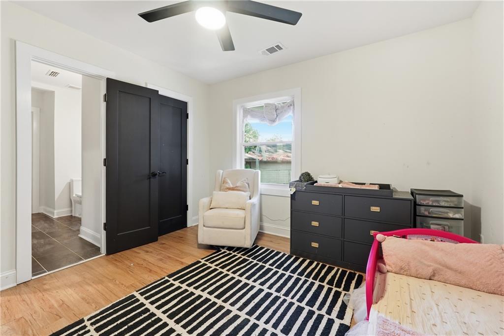 1973 Glendale Drive Decatur, GA 30032 - Photo 21 of 28 a bedroom with a bed and a couch