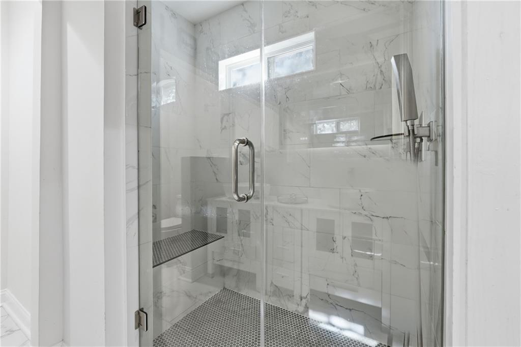 1973 Glendale Drive Decatur, GA 30032 - Photo 27 of 28 a bathroom with a glass shower door