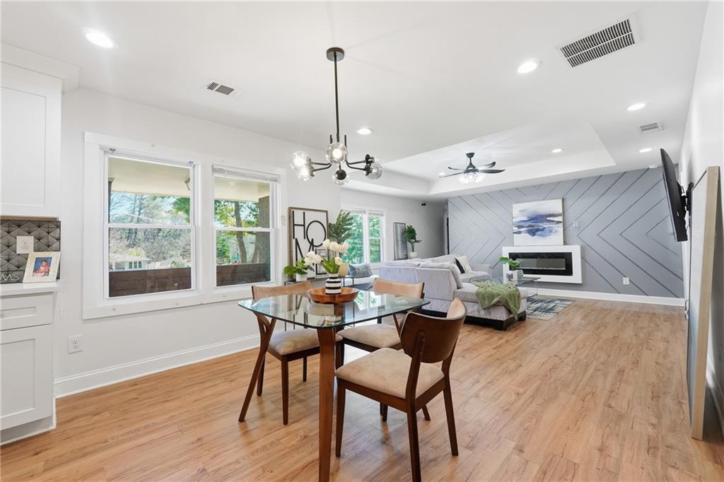1973 Glendale Drive Decatur, GA 30032 - Photo 8 of 28 a view of a dining room with furniture window and wooden floor