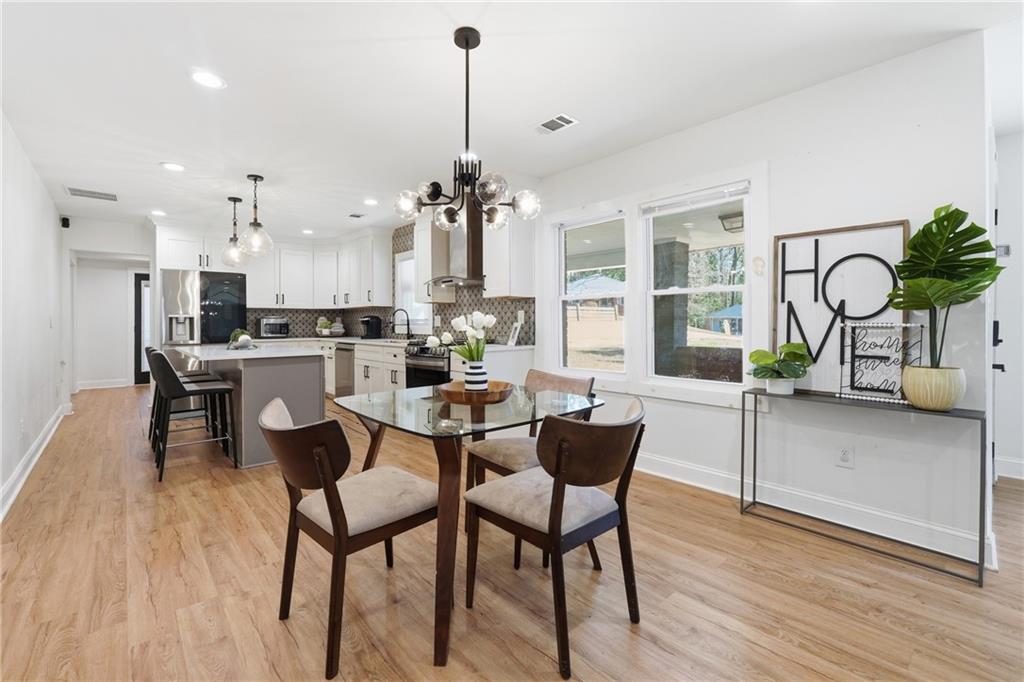 1973 Glendale Drive Decatur, GA 30032 - Photo 10 of 28 a dining room with furniture and wooden floor