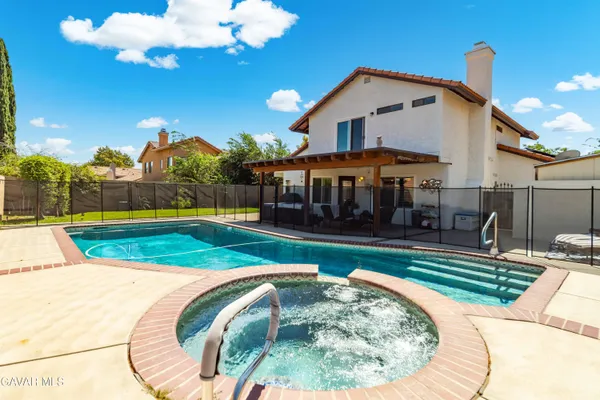 a swimming pool with outdoor seating yard and livingroom