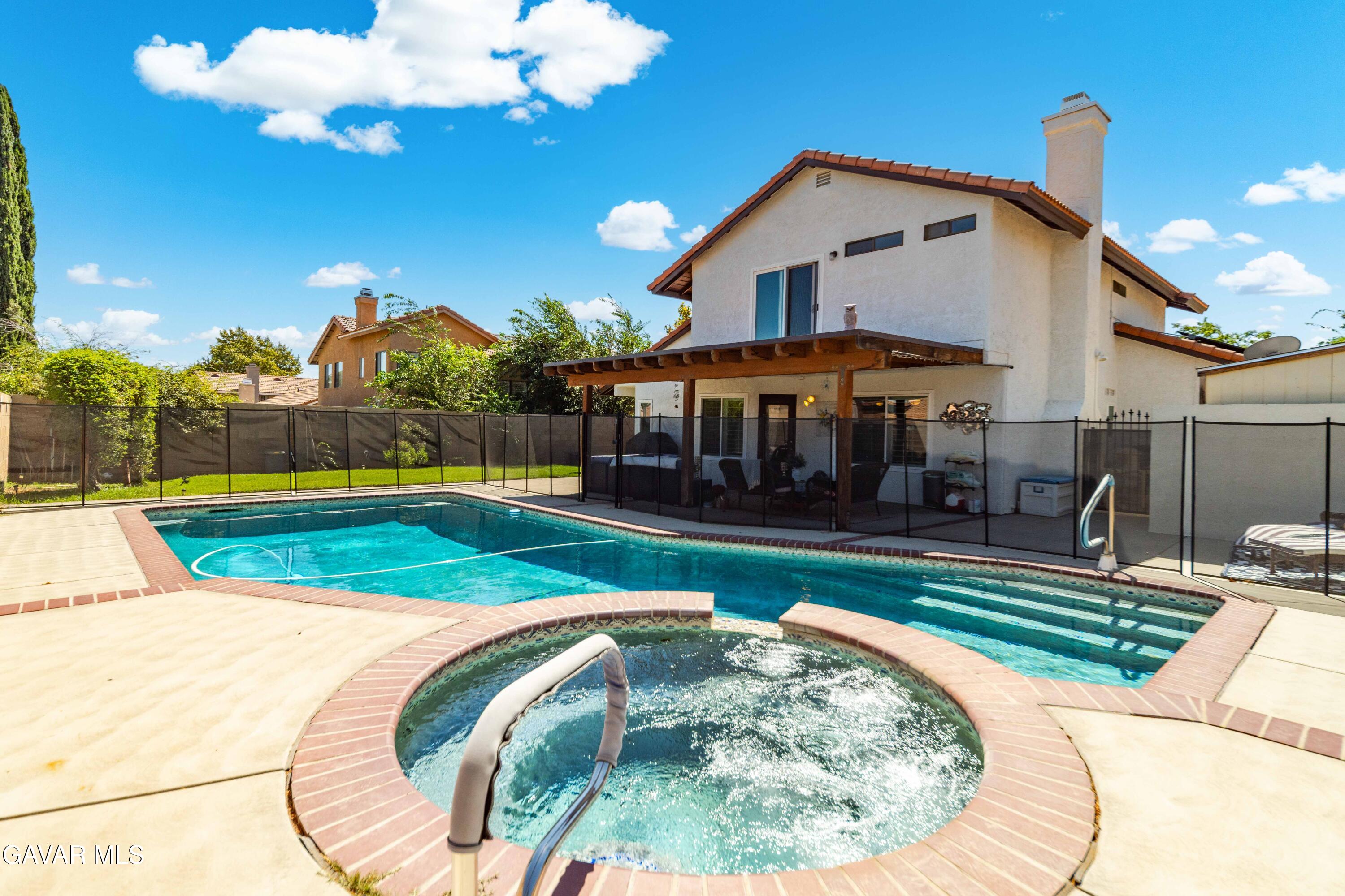 a swimming pool with outdoor seating yard and livingroom