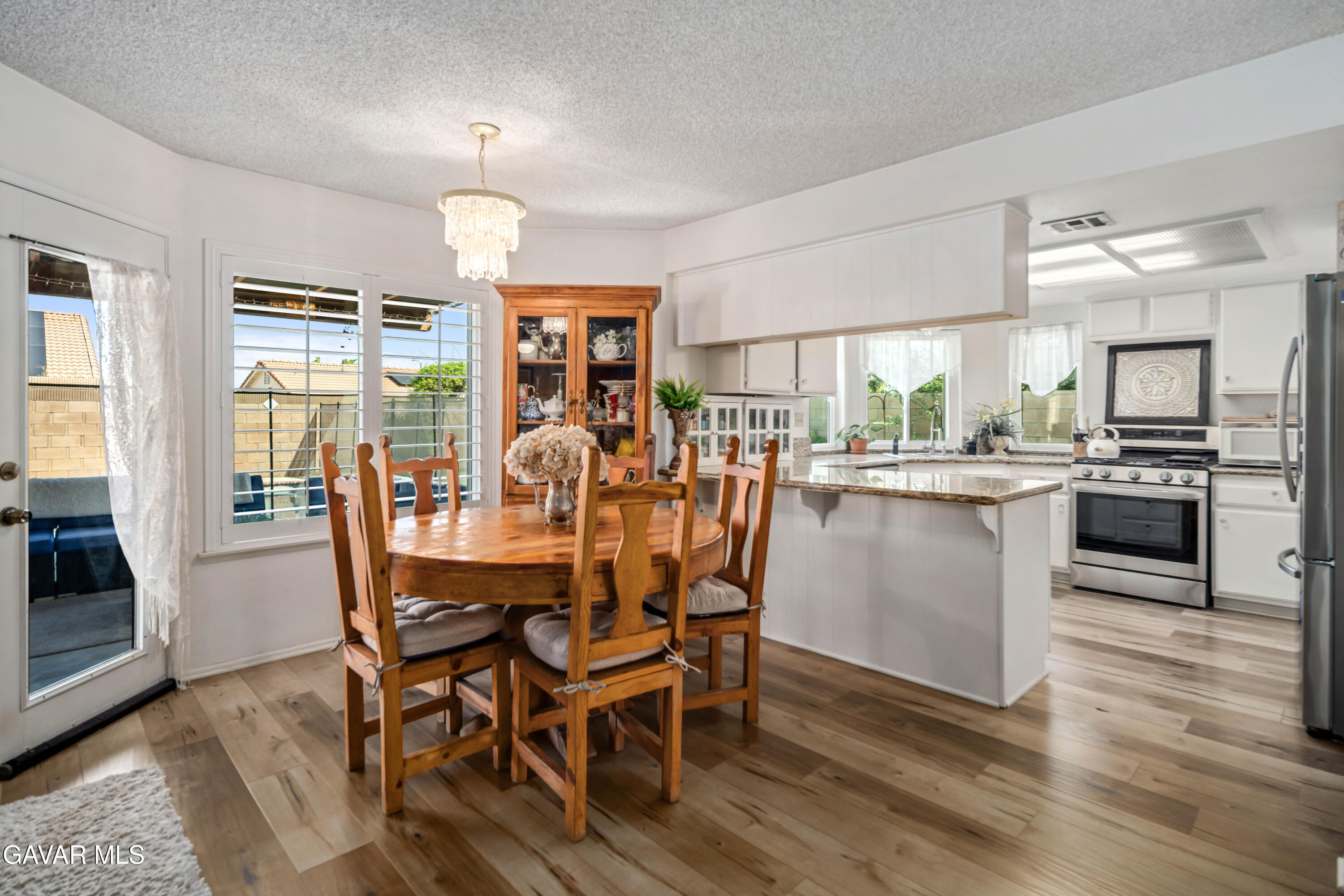 4535 Talento Way Palmdale, CA 93551 - Photo 12 of 43 a view of a dining room with furniture window and wooden floor