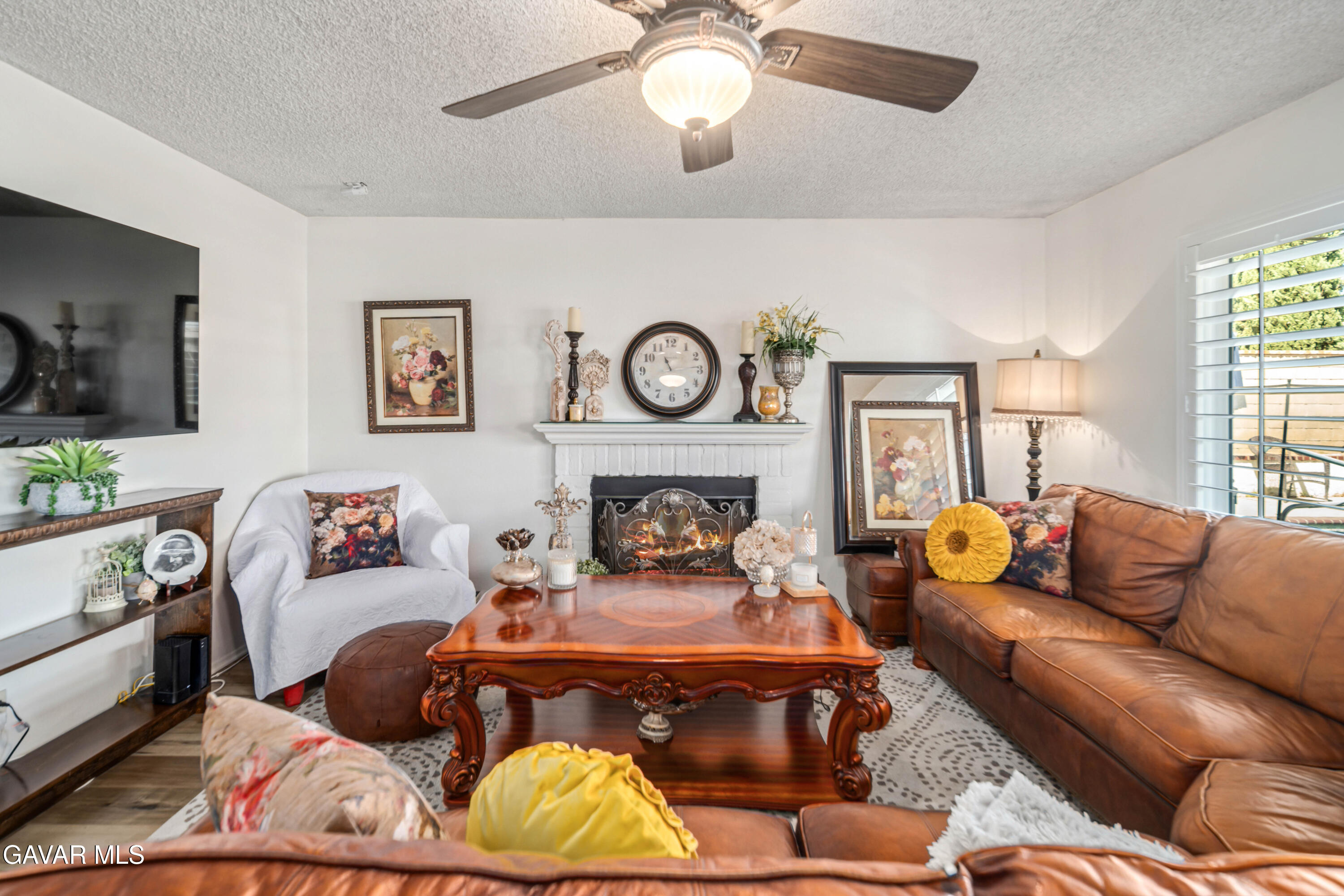 4535 Talento Way Palmdale, CA 93551 - Photo 14 of 43 a living room with furniture and a fireplace