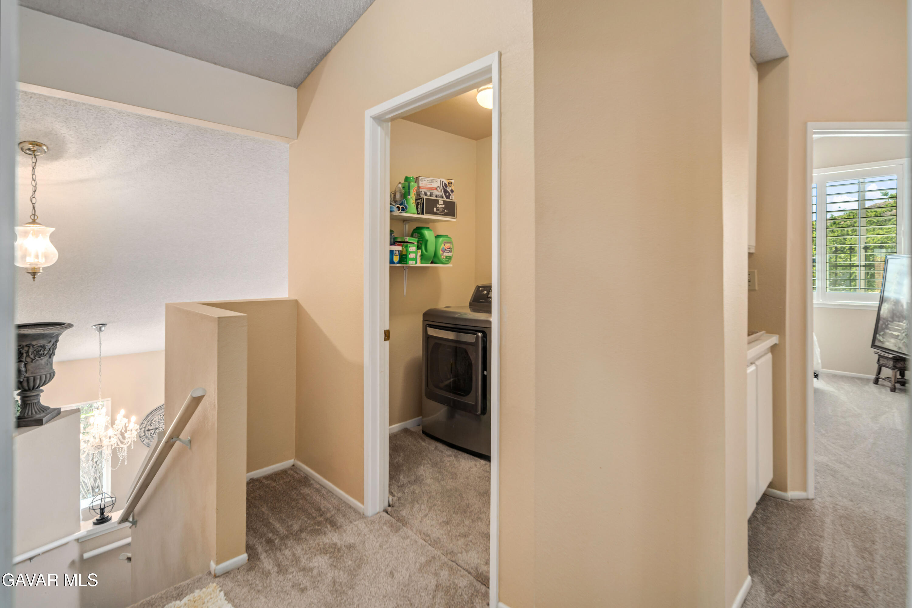 4535 Talento Way Palmdale, CA 93551 - Photo 20 of 43 a view of a hallway with bathroom and wooden floor