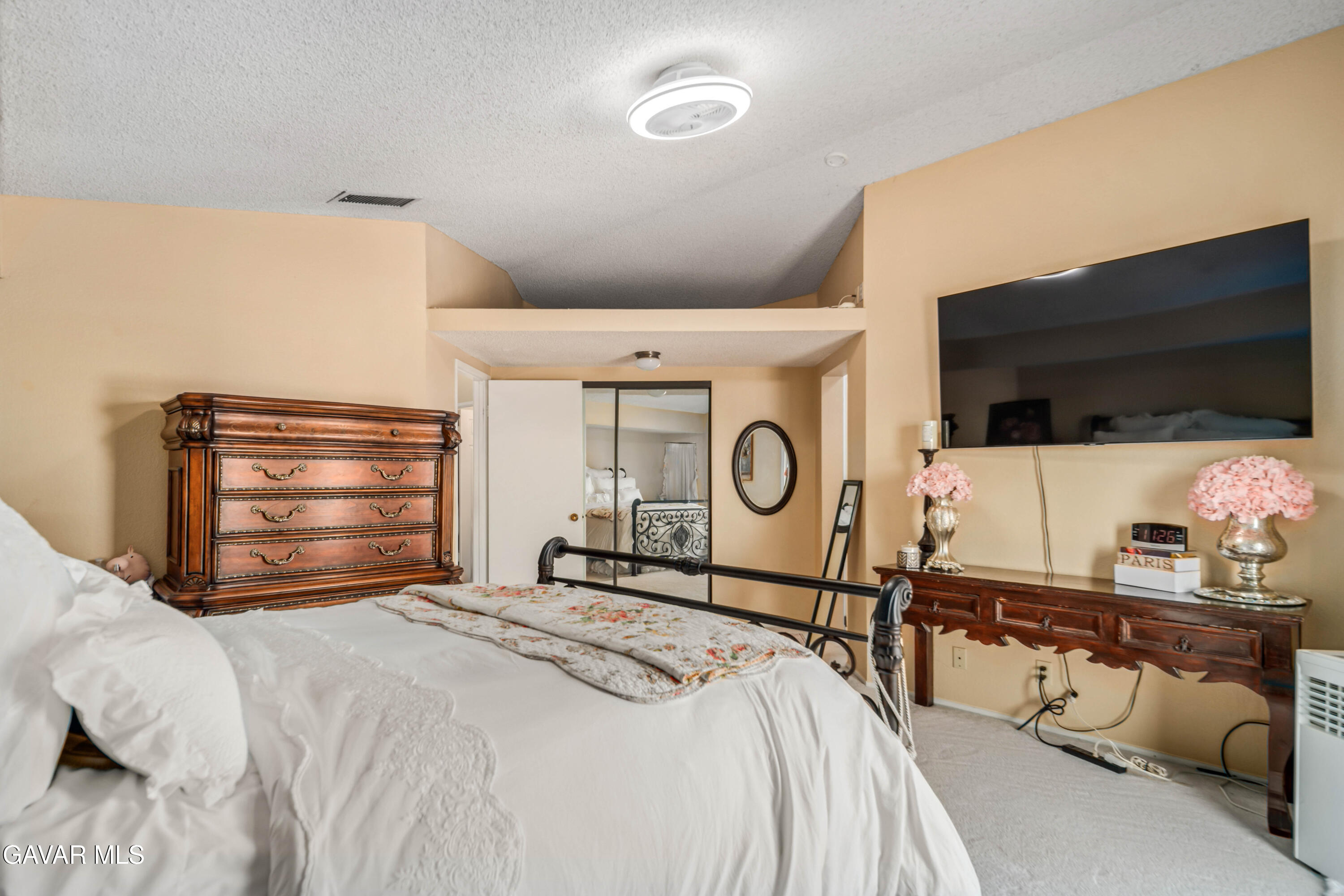 4535 Talento Way Palmdale, CA 93551 - Photo 24 of 43 a bedroom with a bed and a flat screen tv