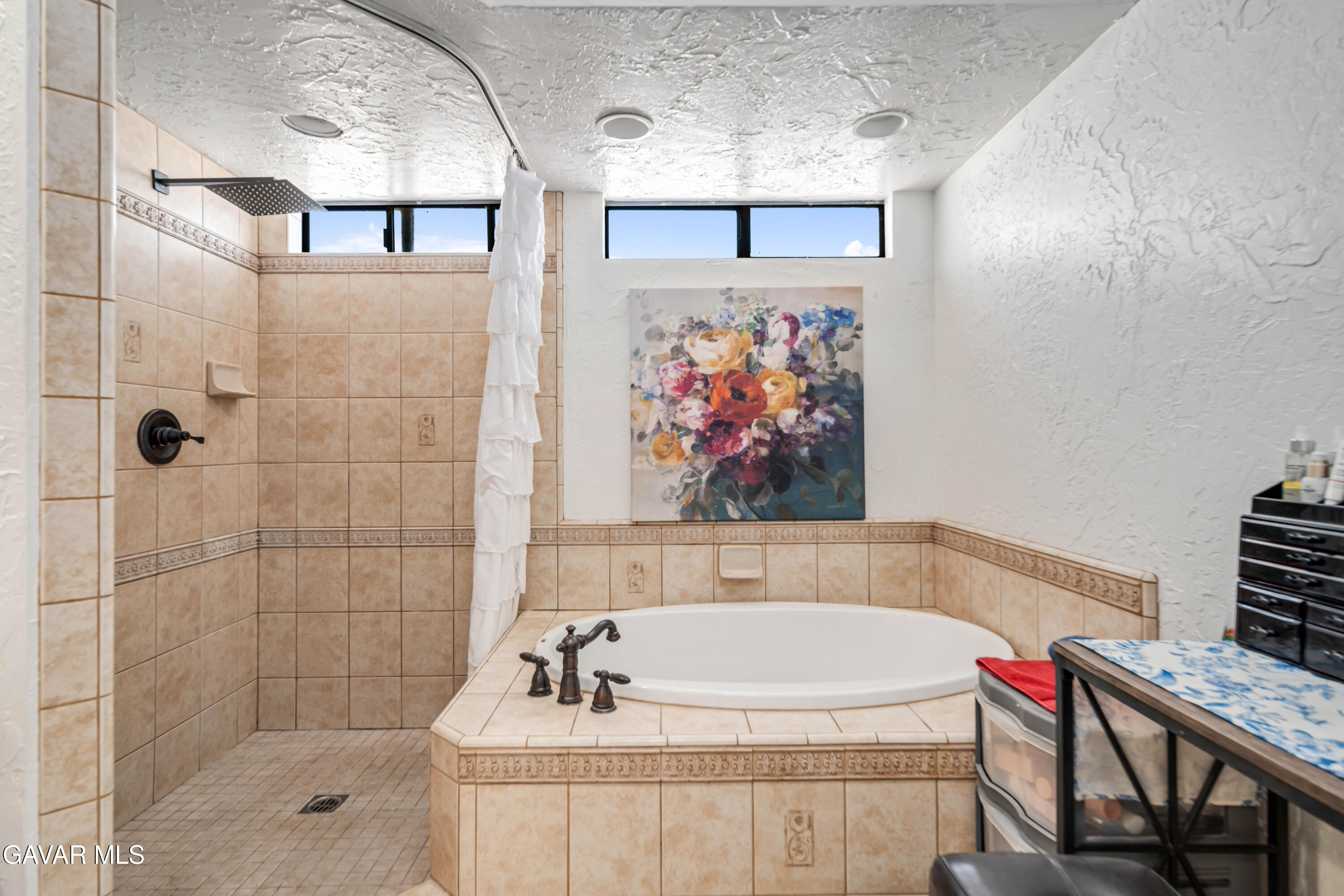 4535 Talento Way Palmdale, CA 93551 - Photo 26 of 43 a bathroom with a bathtub and shower