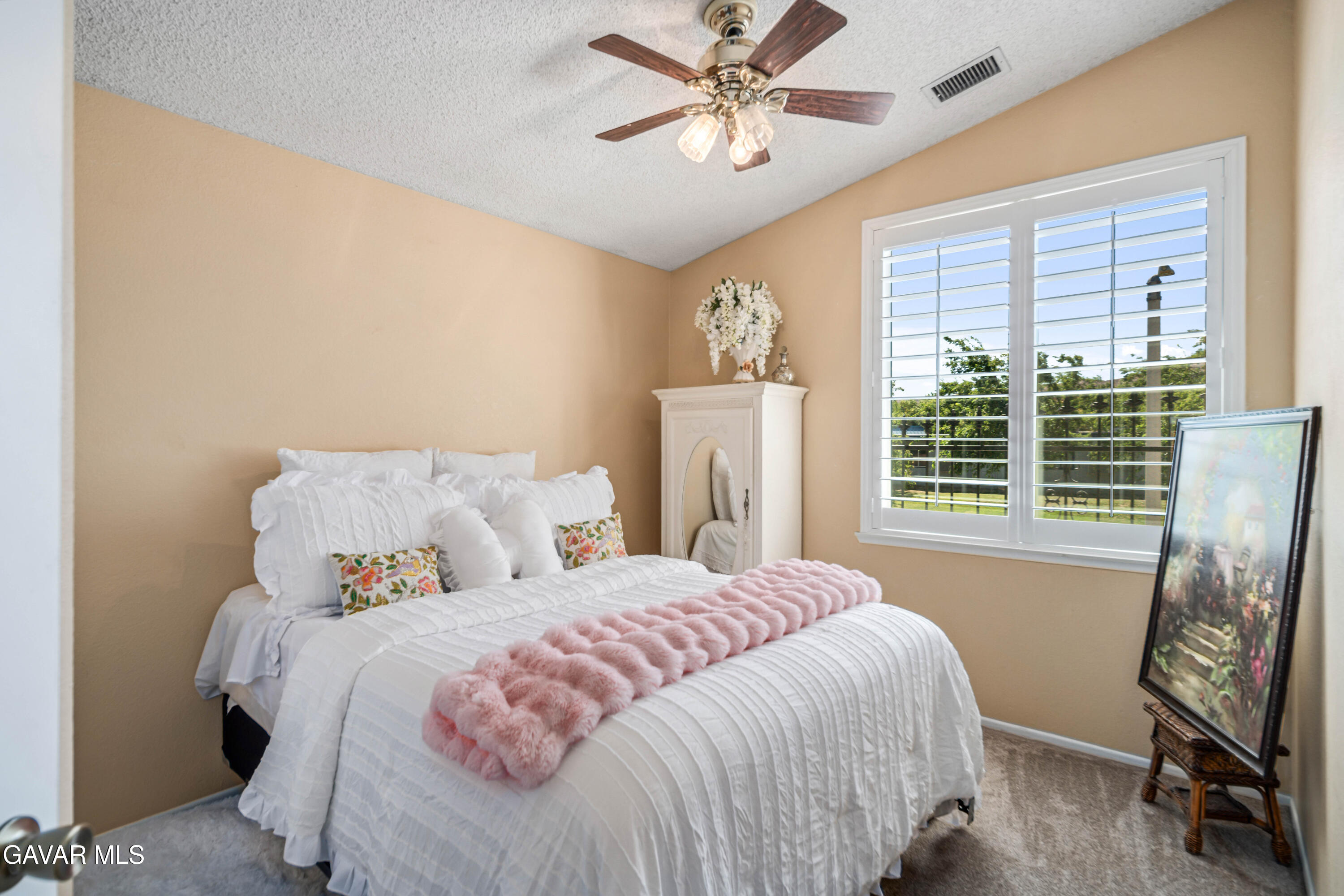 4535 Talento Way Palmdale, CA 93551 - Photo 27 of 43 a bedroom with a bed and a window