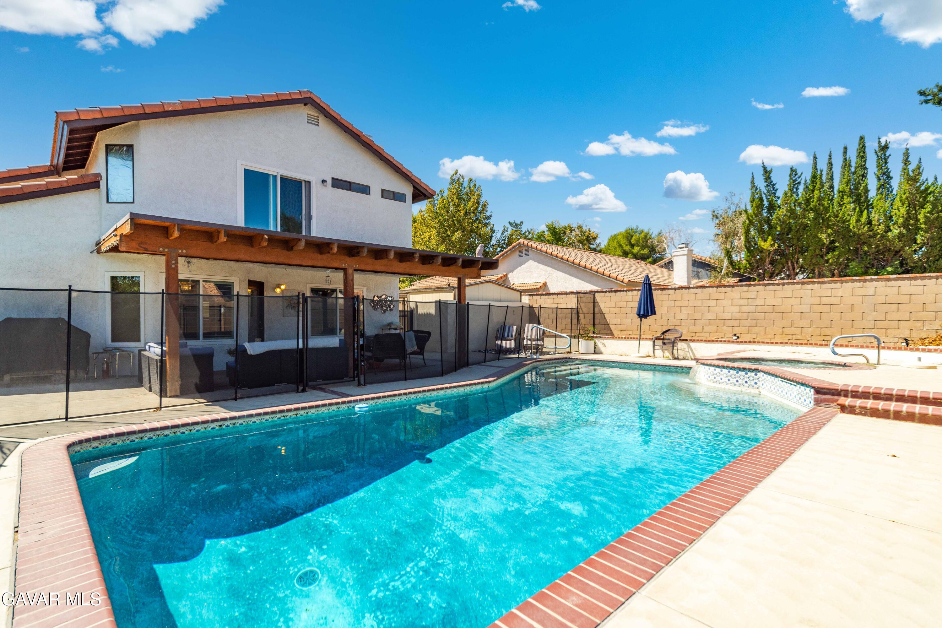 4535 Talento Way Palmdale, CA 93551 - Photo 37 of 43 a view of a house with a swimming pool